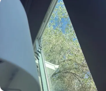 Pristine window cleaning result showing clear blue sky
